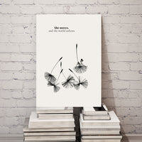 Poster with black and white design on a stack of books against a white brick wall.