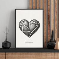 Framed artwork of a geometric heart design on a wall with decorative vases.