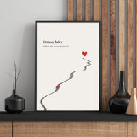 Framed artwork with a heart and text on a wall with decorative vases.