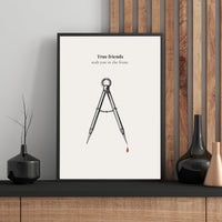 Framed artwork with a compass and text on a wall with decorative elements. True Friends Quote 