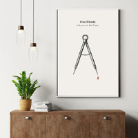 True Friend gift poster Framed artwork with a compass and text on a wall above a wooden cabinet.