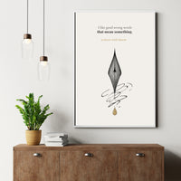 Framed artwork with a quote and design on a wall above a wooden cabinet with a plant and books.