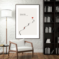 Framed artwork with a heart and path on a wall in a living room setting.
