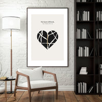 Framed artwork with a geometric heart design in a living room setting.