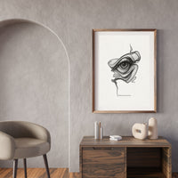 Framed abstract artwork on a wall above a wooden console table with decorative items.
