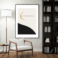 Modern interior with a framed artwork, chair, lamp, and bookshelf.