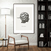 Framed artwork of a head with puzzle pieces on a wall in a modern living room.