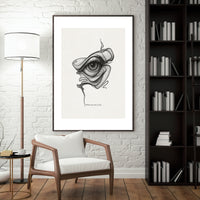 Framed artwork of an eye on a wall in a modern living room.