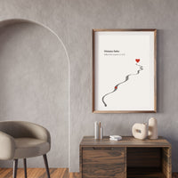 Framed artwork with a heart and path on a wall in a modern room.