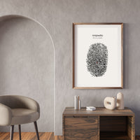 Framed artwork with fingerprint design on a wall in a modern interior setting.
