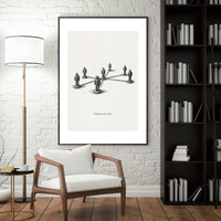Modern interior with a framed artwork on the wall, wooden chair, and bookshelf.