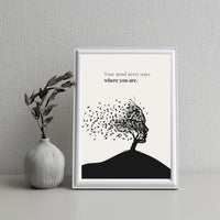Framed artwork with a tree silhouette and motivational quote on a textured wall.