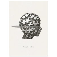 Minimalist black and white poster of a human head made of puzzle pieces with the quote “Identity is assembled”