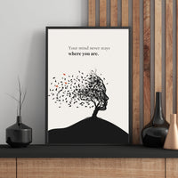 Minimalist poster with a human head silhouette made of tree branches and leaves blowing in the wind on cream background — Your mind never stays where you are quote by Monoquote