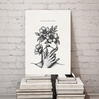 Minimalist black and white poster featuring a hand holding blooming flowers with the quote “Care creates what survives”
