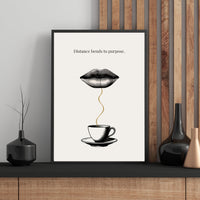 Framed artwork with a coffee cup and lips design on a wall with wooden paneling.