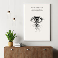 Minimalist poster of a detailed ink-drawn eye with a red heart in the pupil and roots growing from beneath on cream background — It is only with the heart that one can see rightly quote by Monoquote