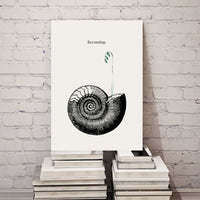 Art print with a black and white illustration of a shell on a white background, leaning against a stack of books against a white brick wall.