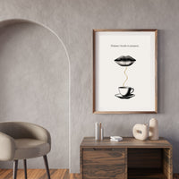 Framed artwork on a wall above a wooden desk with decorative items.