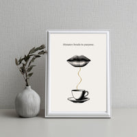 Framed artwork with a coffee cup and lips design on a textured wall background